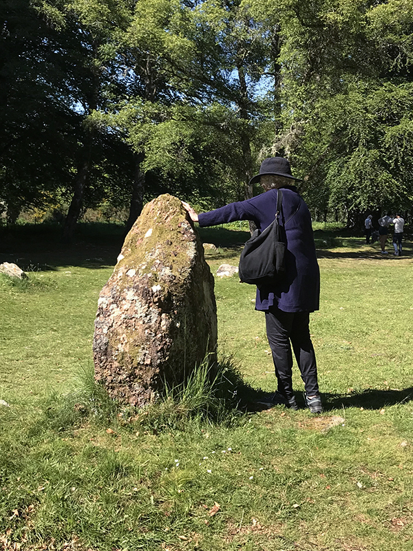 Hannah touching a standing stone