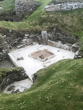 Ancient dwelling excavated in grassy area