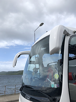 Bus windshield with antenna-like mirros