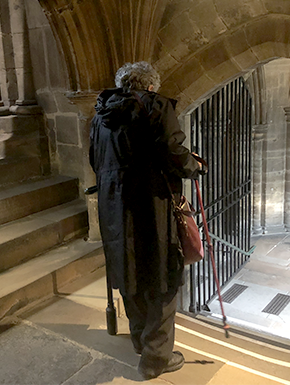 Susan at steps in Glasgow cathedral