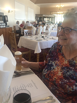 Susan smiling at dinner table