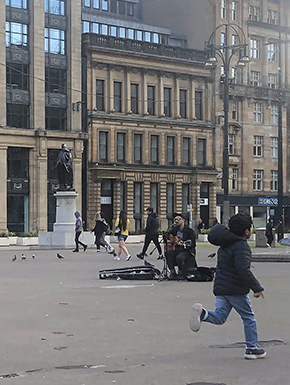 Musician and boy running