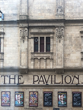 Photo of Glasgow building with theater posters