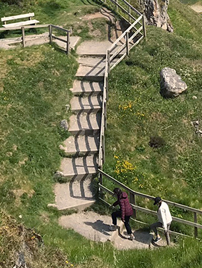 Steps with climbers showing how steep