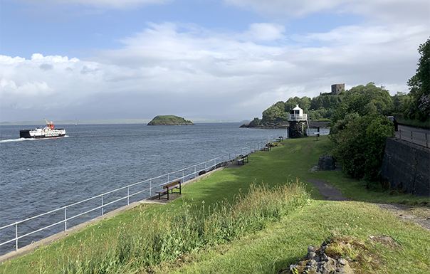 View of sea with boat from town