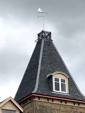 Peeked roof with sailboat weathervane