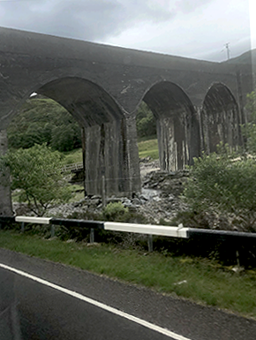 View from bus with arched bridge