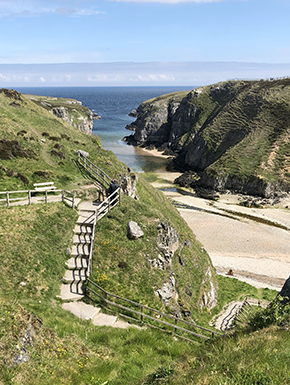 Steps down cliff by sea