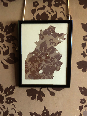 Framed scrap of old wallpaper