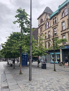 Blue police box on pedestrian mall