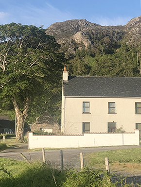 House with hill behind