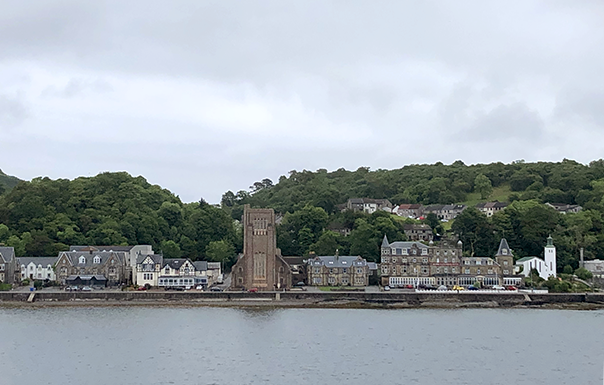 Village from across the water, hills behind