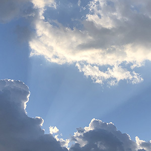 sun breaking over cloud