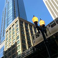 train, light, old and new buildings