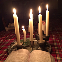 book open to candlelight