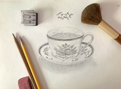 Tea cup with pencil supplies