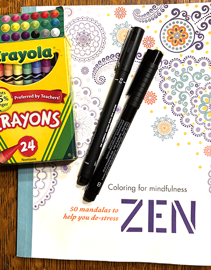 Zen coloring book with crayons and pens