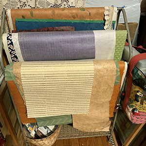 Large sheets of paper on a quilt stand